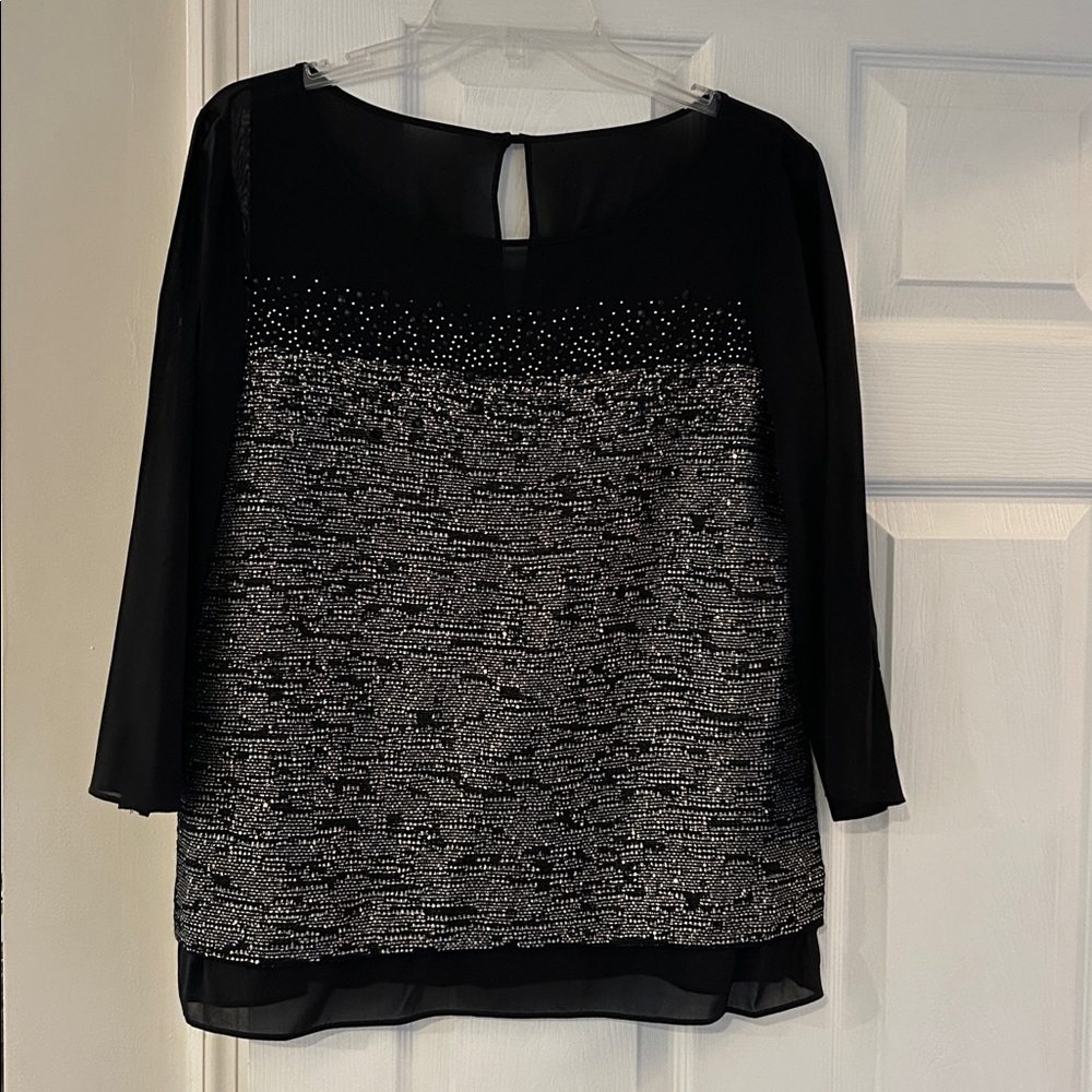 St. John NWT Med.  Elegant Black and Silver Women's Top w/ shear sleeves.